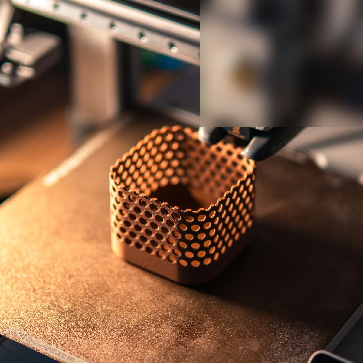 A honeycomb-textured 3D-printed catch-all being printed